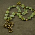 Item N3. African turquoise coins - 12 mm- strung with bronze seed beads and Swarovski crystal accents, bronze toggle clasp - 17" length plus 1.5" cross- Bronze Celtic Cross by Dan Riccio       ( $75 plus $5.20 S/H)