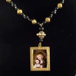 Item N12. Black onyx, strung with gold plated ornate spacers, adorned with a framed pendant of the blessed Virgin and child - 20" length plus 1.5" pendant - ($75 plus $5.20 S/H)