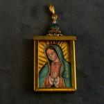 Our Lady of Guadalupe - illuminated minature by Jed Gibbons set in brass locket (1" x1.5")  $375.00 plus $15.00 S/H and insurance.