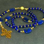 Lapis lazuli (8mm) with oval Lapis Paters, gold vermeil bead caps with Swarovski crystal accents- bronze casting of antique Ethiopean cross $200.00 ( plus $7.95 S/H/insurance)